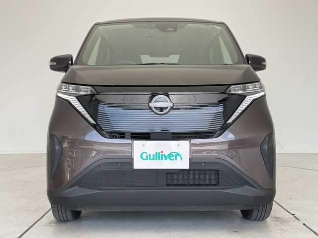 日産 サクラ X 愛知県 2023(令5)年 0.4万km アッシュブラウンM 純正9型ディスプレイオーディオ　ナビ機能なし/バックカメラ/コーナーセンサー/純正アルミホイール/LEDヘッドライト/オートライト/ETC/衝突軽減システム/Bluetooth/ステアリングスイッチ/スマートキー/プッシュスタート