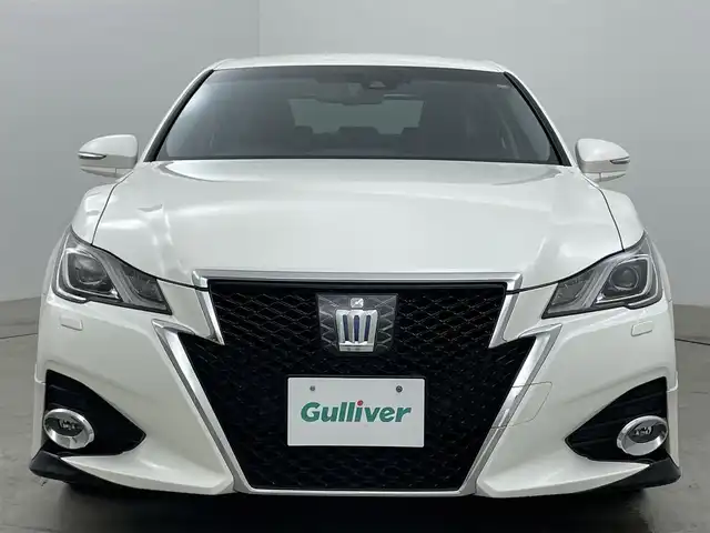 トヨタ クラウン ハイブリッド アスリートG 岡山県 2016(平28)年 6.9万km ホワイトパールクリスタルシャイン 純正8インチメモリナビゲーション		/【フルセグ/Bluetooth/DVD/MSP】		/バックカメラ		/純正18inアルミホイール+サマータイヤ：装着			/レーダークルーズコントロール	/ブラインドスポットモニター	/ビルトインETC		/LEDヘッドライト（AUTO機能付き）		/シートヒーター		/ステアリングヒーター/エアシート/横滑り防止機能		/衝突軽減システム		/車線逸脱防止システム				/スマートキー		/ステアリングスイッチ		/プッシュスタート		/コーナーセンサー				/純正フロアマット