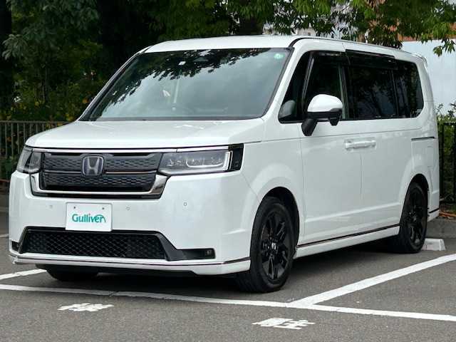 ホンダ ステップワゴン スパーダ eHEV 宮城県 2022(令4)年 5.8万km プラチナホワイトパール クルーズコントロール/レーンキープアシスト/シートヒーター/オートライト/純正SDナビ/デジタルインナーミラー/電動リアゲート/コーナーセンサー前後/純正ビルドインETC2.0/フルセグTV/Bluetooth接続/バックカメラ/ハーフレザーシート/両側パワースライドドア/ドライブレコーダー前後/オットマン/3列シート/フルフラットシート/純正フロアマット/LEDヘッドライト