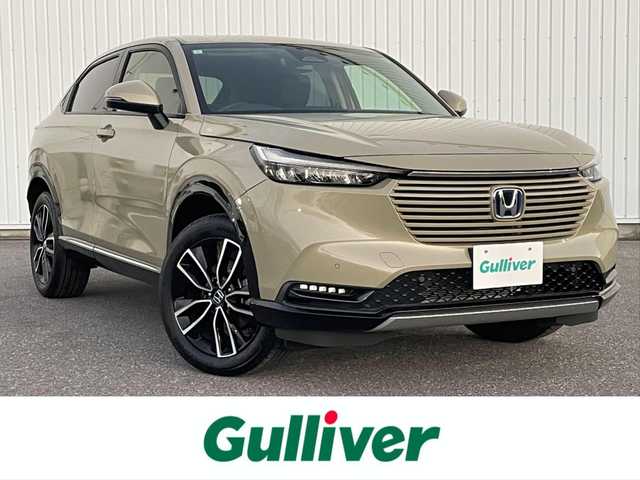 ホンダ ヴェゼル ハイブリッド e:HEV Z 滋賀県 2024(令6)年 0.6万km サンドカーキパール 社外ナビ/(Bluetooth/AM/FM)/衝突軽減ブレーキ/アダプティブクルーズコントロール/レーンキープアシスト/ブラインドスポットモニター/バックカメラ/コーナーセンサー/電動リアーゲート/ハーフレザーシート/シートヒーター/ステアリングヒーター/電動パーキング/ブレーキホールド/LEDオートライト/オートハイビーム/フォグ/パドルシフト/ETC/USB/寒冷地仕様