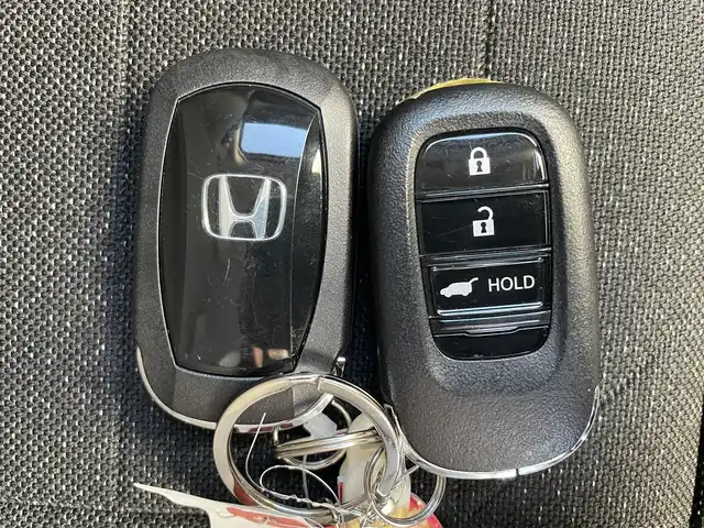 ホンダ ヴェゼル ハイブリッド e:HEV Z 滋賀県 2024(令6)年 0.6万km サンドカーキパール 社外ナビ/(Bluetooth/AM/FM)/衝突軽減ブレーキ/アダプティブクルーズコントロール/レーンキープアシスト/ブラインドスポットモニター/バックカメラ/コーナーセンサー/電動リアーゲート/ハーフレザーシート/シートヒーター/ステアリングヒーター/電動パーキング/ブレーキホールド/LEDオートライト/オートハイビーム/フォグ/パドルシフト/ETC/USB/寒冷地仕様