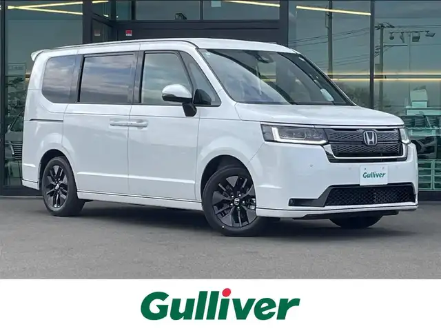 ホンダ ステップワゴン スパーダ eHEV 東京都 2025(令7)年 0.1千km プラチナホワイトパール 登録済未使用車/純正11.4インチナビ/バックカメラ/両側パワースライドドア/パワーテールゲート/レザーシート/シートヒーター/オットマン/パドルシフト/ホンダセンシング/衝突軽減ブレーキ/レーンキープアシスト/レーダークルーズコントロール/ブラインドスポットモニター/コーナーセンサー/LEDヘッドライト/スマートキー
