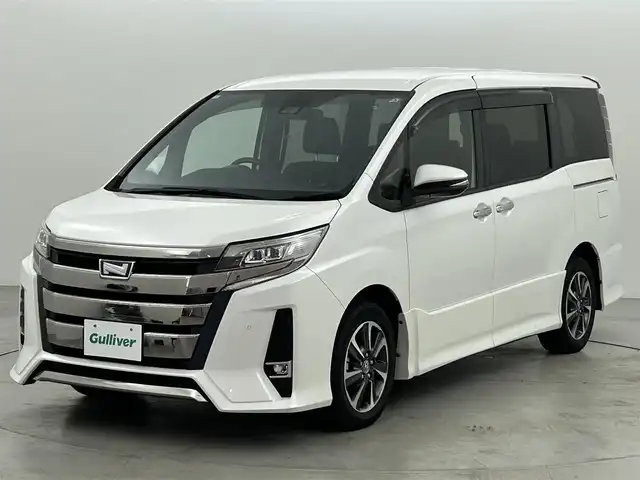 トヨタ ノア Si ダブルバイビーⅡ 福岡県 2020(令2)年 1.9万km ホワイトパールクリスタルシャイン 後席モニター　/純正９型ナビ（フルセグＴＶ）　/バックカメラ　/ビルトインＥＴＣ　/クルーズコントロール　/衝突被害軽減ブレーキ　/レーンキープ　/ＰＫＳＢ　/先行車発進お知らせ　/ＭＴモード付き　/両側電動スライドドア