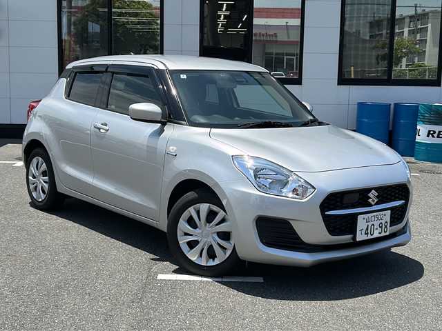 スズキ スイフト HYBRID MG 山口県 2022(令4)年 1.5万km スターシルバーメタリック レーダークルーズコントロール/ビルトインETC/純正フロアマット/オートライト/運転席シートヒーター/パーキングアシスト/アイドリングストップ/スマートキー/スペアキー/プッシュスタート/デュアルカメラブレーキサポート/横滑り防止装置/レーンキープアシスト/盗難防止装置
