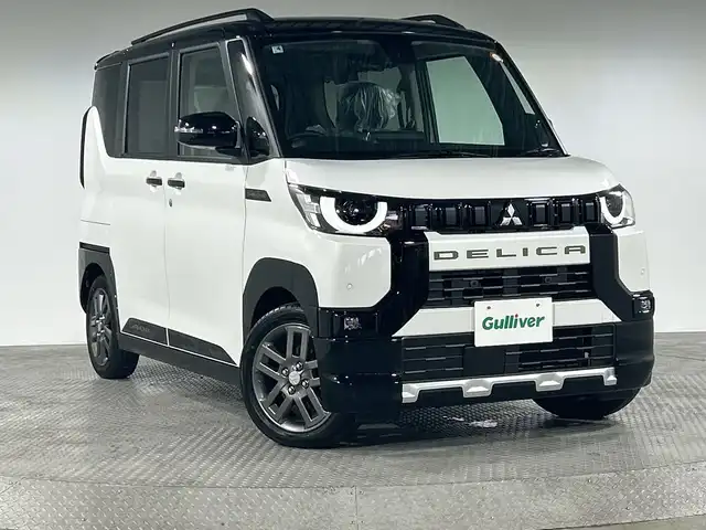 三菱 デリカミニ T プレミアム 神奈川県 2025(令7)年 0.1万km未満 パールⅡ 純正9型ディスプレイオーディオ/マルチアラウンドモニター/両側ハンズフリースライドドア/ハーフレザーシート/e-Assist/衝突被害軽減ブレーキシステム（歩行者検知付き）/踏み間違い衝突防止アシスト/オートマチックハイビーム/標識認識システム/先行車発進通知/車線逸脱警報システム/車線逸脱防止支援機能/ふらつき警報/前方衝突予測警報/デジタルルームミラー/ダウンヒルアシストコントロール/シートヒーター/ステアリングヒーター/パドルシフト/LEDヘッドライト/オートライト/オートマチックハイビーム/フロントフォグランプ/純正15インチAW/スマートキー/スペアキー1本/ルーフレール