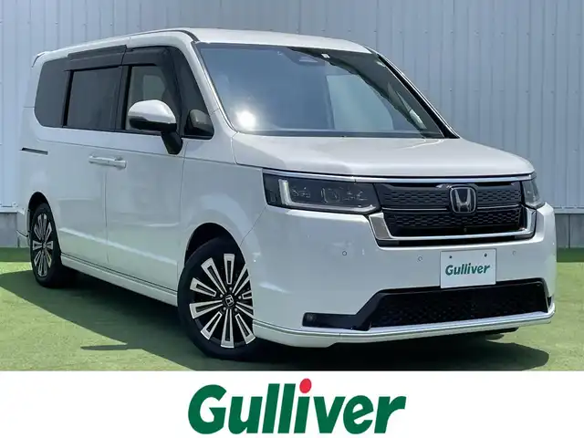 ホンダ ステップワゴン スパーダ eHEV プレミアムライン 香川県 2022(令4)年 3万km プラチナホワイトパール 登録時走行距離：29267km/純正SDナビゲーション/→CD/DVD 再生/→フルセグTV/全方位カメラ/ビルトインETC/ステアリングリモコン/レーダークルーズコントロール/シートヒーター/パワーシート/両側パワースライド/前後コーナーセンサー/LEDオートライト/フォグランプ/電格ウィンカーミラー/レーンキープアシスト/横滑り防止装置/衝突被害軽減システム/スマートキー
