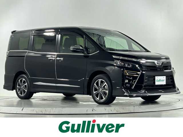 トヨタ ヴォクシー ZS 煌Ⅲ 佐賀県 2021(令3)年 3.7万km ブラック 社外11インチナビ（ALPAINE）/フルセグTV/Bluetooth/CD/DVD/バックカメラ/社外12.8インチフリップダウンモニター（ALPAINE）/モデリスタエアロ/両側パワースライドドア/ビルトインETC/前方・後方ドライブレコーダー/クルーズコントロール/トヨタセーフティーセンス/パーキングソナー/コーナーセンサー/先行車発進告知機能/衝突被害軽減ブレーキ/純正フロアマット/純正16インチアルミホイール/社外シートカバー/Wエアコン