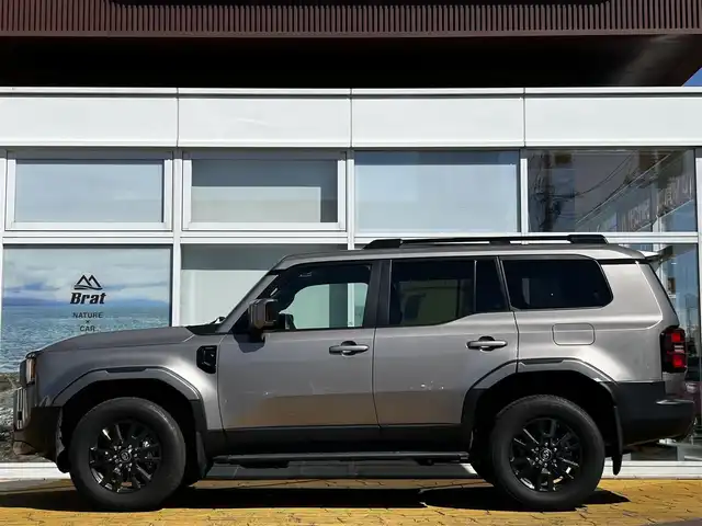 トヨタ ランドクルーザー ２５０ VX 道北・旭川 2024(令6)年 1.3万km アバンギャルドブロンズメタリック ワンオーナー/JBLサウンドシステム/全方位カメラ/フルセグTV/トヨタチームメイト/モデリスタパッケージ（フロント、リア）/モデリスタフェンダーガーニッシュ/丸目ヘッドライト/おくだけ充電/レザーシート/前席シートヒーター＆クーラー/ステアリングヒーター/デジタルインナーミラー（ドラレコ機能付き）/コーナーセンサー/ブラインドスポットモニター/パワーバックドア