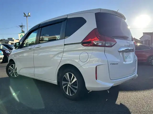 ホンダ フリード ハイブリット EX 愛知県 2017(平29)年 10.2万km ホワイトオーキッドパール ホンダセンシング/　・衝突軽減ブレーキ/　・誤発進抑制機能/　・アダプティブクルーズコントロール/　・車線維持システム/両側パワースライド/純正HDDナビ/　・フルセグTV/　・Bluetootｈ/　・CD/DVD/　・AM/FM/　・iPod/純正フロアマット/純正15インチAW/ハーフレザーシート/シートヒーター（前席）/LEDヘッドライト/オートライト/ビルトインETC/スマートキー