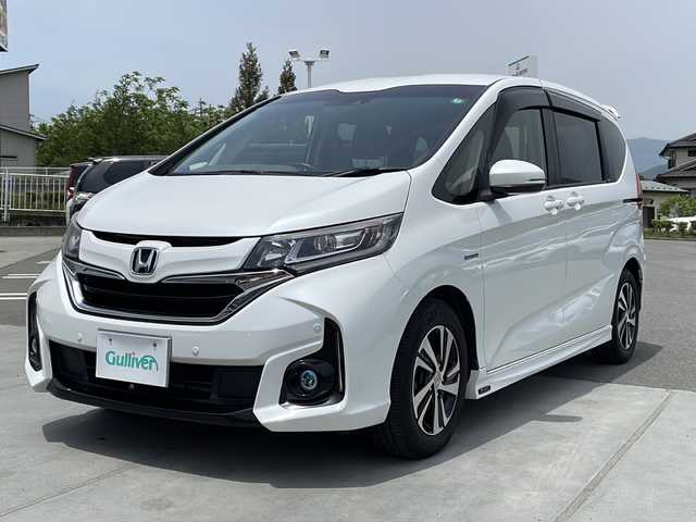 ホンダ フリード ハイブリット EX 山梨県 2016(平28)年 6.1万km ホワイトオーキッドパール 純正ナビ/ＥＴＣ/クルーズコントロール/シートヒーター/両側パワースライドドア　/ドライブレコーダー　/プッシュスタート/純正アルミホイール/オートマチックハイビーム/純正フロアマット/3列シート