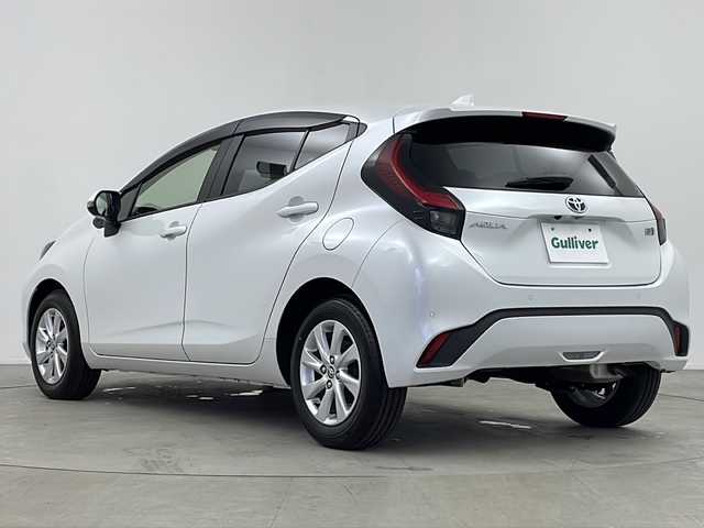 トヨタ アクア Z 鹿児島県 2021(令3)年 1万km プラチナホワイトパールマイカ 純正ナビ機能付きディスプレイオーディオ　/レーダークルーズコントロール　/前後ドライブレコーダー　/ハーフレザー　/シートヒーター/１００Ｖコンセント　/ウインカーミラー　/オートマチックハイビーム　/オートリトラミラー　/純正アルミホイール/純正フロアマット/ドアバイザー/ハンドルヒーター/ステアリングスイッチ/レーンキープアシスト/前後コーナーセンサー/D席パワーシート/保証書/取扱説明書/スペアキー1本