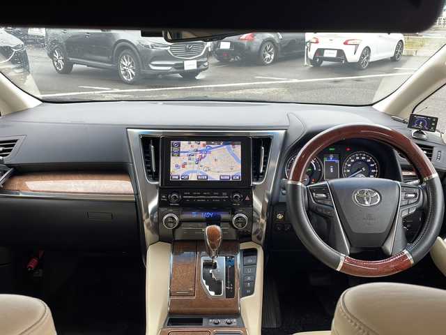 トヨタ アルファードハイブリット エグゼクティブ ラウンジ 新潟県 2015(平27)年 13.8万km ブラック ４WD/フリップダウンモニター/モデリスタエアロ/JBLプレミアムサウンドシステム/パノラミックビューモニター/本革シート/エグゼクティブラウンジシート/レーダークルーズコントロール/プリクラッシュセーフティ/オートマチックハイビーム/クリアランスソナー/横滑り防止装置/両側パワースライドドア/パワーバックドア/オートブレーキホールド/AC100V1500Wアクセサリーコンセント/ETC2.0/ドライブレコーダー/純正ナビ/（CD/DVD/Blu-rayDisc/フルセグ/USB/Bluetooth）/LEDヘッドランプ/純正17インチアルミホイール
