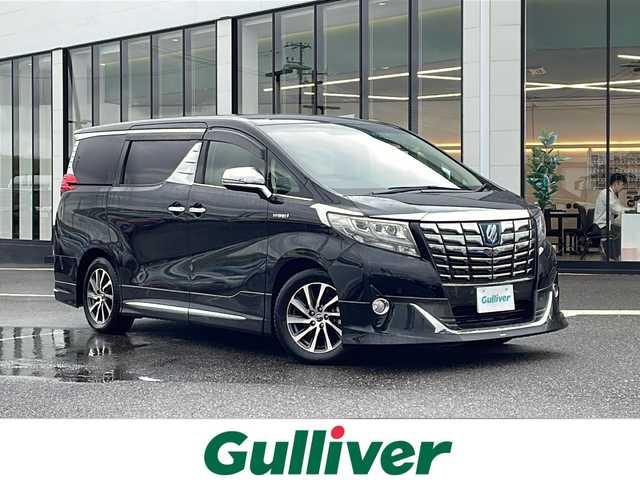 トヨタ アルファードハイブリット エグゼクティブ ラウンジ 新潟県 2015(平27)年 13.8万km ブラック ４WD/フリップダウンモニター/モデリスタエアロ/JBLプレミアムサウンドシステム/パノラミックビューモニター/本革シート/エグゼクティブラウンジシート/レーダークルーズコントロール/プリクラッシュセーフティ/オートマチックハイビーム/クリアランスソナー/横滑り防止装置/両側パワースライドドア/パワーバックドア/オートブレーキホールド/AC100V1500Wアクセサリーコンセント/ETC2.0/ドライブレコーダー/純正ナビ/（CD/DVD/Blu-rayDisc/フルセグ/USB/Bluetooth）/LEDヘッドランプ/純正17インチアルミホイール