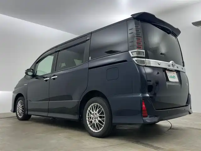 トヨタ ヴォクシー ハイブリッド ZS 煌Ⅱ 岡山県 2020(令2)年 4.9万km ブラッキッシュアゲハガラスフレーク 純正9インチナビ　/(Ｂｌｕｅｔｏｏｔｈ/フルセグＴＶ/CD/DVD)/衝突軽減ブレーキシステム/クルーズコントロール/オートハイビーム/ビルトインＥＴＣ/ＬＥＤヘッドライト/シートヒーター/前後ドライブレコーダー/バックカメラ/両側電動スライドドア/オートライト/フォグランプ/純正フロアマット/スマートキー×2/新車保証書/取扱説明書