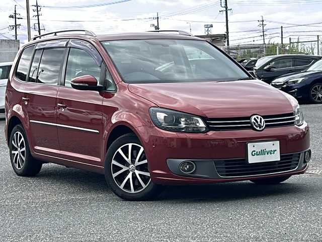 フォルクスワーゲン ゴルフ トゥーラン TSI ハイライン 愛知県 2013(平25)年 11.9万km ワイルドチェリーメタリック 純正ナビ/DVD/バックカメラ/アイドリングストップ/ミラーウィンカー/パドルシフト/純正フロアマット/純正アルミホイール/革巻きステアリング/クリアランスソナー/前後/フォグランプ/ルーフレール/カーテンエアバッグ/ETC/ドアバイザー