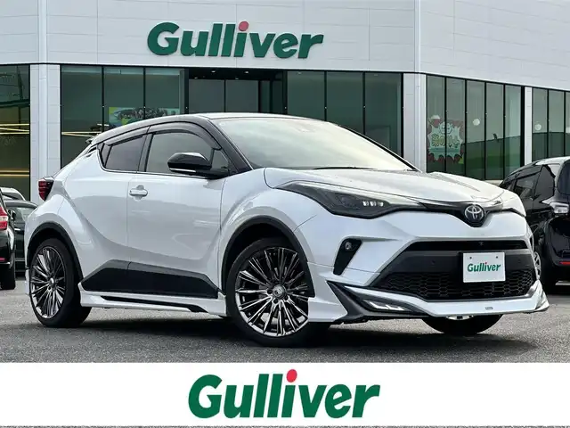 トヨタ Ｃ－ＨＲ G モード ネロセーフティプラスⅡ 島根県 2022(令4)年 11.1万km ホワイト 登録時走行距離　110492km/ワンオーナー/取扱説明書/保証書/純正ディスプレイオーディオ/・AppleCarPlay・AndroidAuto/フルセグテレビ/レーダークルーズコントロール/アラウンドビューモニター/モデリスタ　フルエアロ/ブラインドスポットモニター/電動パーキング/ブレーキホールド/コーナーセンサー/ハーフレザー/シートヒーター（DN席）/純正フロアマット/フォグランプ/プリクラッシュセーフティシステム/レーントレーシングアシスト/ロードサインアシスト/ETC