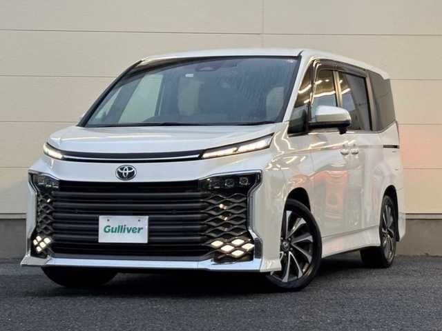 トヨタ ヴォクシー S－Z 茨城県 2022(令4)年 8.7万km ホワイトパールクリスタルシャイン ワンオーナー/ブラインドスポットモニター/ディスプレイオーディオプラス/・車載メモリーナビ/・DVD/CD/AM/FM/フルセグ/USB/HDMI/Miracast/バックカメラ/ETC2.0ユニット/ハンドルヒーター/セーフティセンス/・プリクラッシュセーフティ/・レーントレーシングアシスト/・レーンディパーチャーアラート/・レーダークルーズコントロール/・オートマチックハイビーム/・ロードサインアシスト/・ドライバー異常時対応システム/・プロアクティブドライビングアシスト/・発進遅れ告知機能/パーキングサポートブレーキ/前後ドライブレコーダー/シートヒーター/純正フロアマット/電動パーキングブレーキ/ブレーキホールド/スマートキー＆プッシュスタート/電動格納ミラー/純正17インチアルミホイール