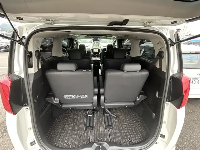 トヨタ アルファード S Cパッケージ 愛媛県 2021(令3)年 1.8万km ホワイトパールクリスタルシャイン 純正ナビ（Bluetooth/フルセグTV）/レーダークルーズコントロール/前後ドライブレコーダー/バックカメラ/USB入力端子/100V充電/三列シート/パワーシート/ステアリングヒーター/シートヒーター/エアシート/サンルーフ/オットマン/電動リアゲート/両側パワースライドドア/純正フロアマット/純正アルミホイール/前後コーナーセンサー/LEDヘッドライト/オートマチックハイビーム
