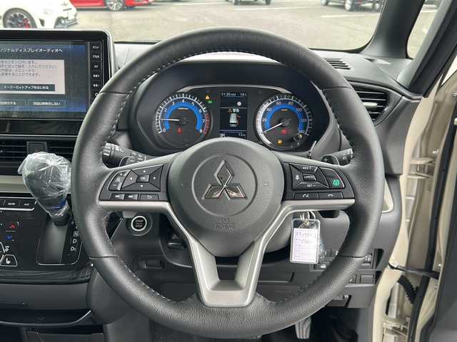 三菱 デリカミニ T プレミアム 岐阜県 2025(令7)年 0.1千km ナチュラルアイボリーメタリック 登録時走行距離13km/ワンオーナー/純正9型ディスプレイオーディオ/全方位カメラ・バックカメラ/Blue tooth・USB入力端子・iPod・AUX/衝突被害軽減システム/コーナーセンサー後方/LEDヘッドライト/オートライト/レーダークルーズコントロール/レーンキープアシスト/横滑り防止装置/盗難防止装置/純正15アルミホイール/エアバッグ運転席・助手席+サイド/ハーフレザーシート/シートヒーター前席/ベンチシート/フルフラットシート/両側パワースライドドア/プッシュスタート/スマートキー/ターボ車/ステアリングヒーター/保証書/取扱説明書/記録簿