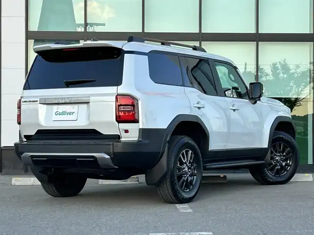 トヨタ ランドクルーザー ２５０ VX 和歌山県 2024(令6)年 0.9万km プラチナホワイトパールマイカ ワンオーナー/純正12.3インチナビ/フルセグTV/Bluetooth/USB/HDMI/全周囲カメラ/ビルトインETC2.0/デジタルインナーミラー/サンルーフ/トヨタセーフティセンス/BSM/レーダークルーズコントロール/クリアランスソナー/パワーバックドア/革巻きステアリング/ステアリングスイッチ/レザーシート/運転席パワーシート/シートメモリー/前席シートヒーター/前席シートベンチレーション/丸目LEDヘッドライト/フォグランプ/オートライト/プッシュスタート/スマートキー/スペアキー/取扱説明書