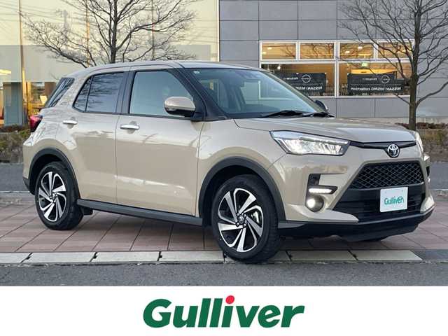 トヨタ ライズ Z 福島県 2025(令7)年 0.5万km ナチュラルベージュマイカM スマートアシスト/・衝突警報/・衝突回避支援ブレーキ機能/・標識認識機能/・先行車発進お知らせ機能/・アダプティブクルーズコントロール/・レーンキープコントロール/・車線逸脱警報機能/・車線逸脱抑制制御機能/・ふらつき警報/・路側逸脱警報/・誤発進抑制機能/社外メモリナビゲーション/型番：X9NX/【CD/DVD/SD/USB/HDMI/Bluetooth/TV】/バックカメラ/前後ドライブレコーダー/ビルトインETC/前席シートヒーター/LEDヘッドライト/・オートライト/・LEDフォグランプ/スマートキー/・プッシュスタート/ステアリングリモコン/アイドリングストップ/社外フロアマット