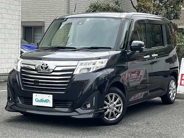 トヨタ ルーミー カスタムG S 埼玉県 2018(平30)年 7.2万km ブラックマイカメタリック 走行距離71671km/ワンオーナー/純正SDナビ（NSZT-W66T）/AM/FM/CD/MSV/フルセグＴＶ/バックカメラ/フリップダウンモニター/純正フロアマット/社外14インチAW(スタッドレス)/両側パワースライドドア/革巻きハンドル/クルーズコントロール/車線逸脱警報/衝突被害軽減システム/横滑り防止装置/先行車発進警報/アイドリングストップ/プッシュスタート/ドアバイザー/LEDヘッドライト/フォグランプ/電動格納ミラー/ウィンカーミラー/スマートキー×１/保証書/取扱説明書