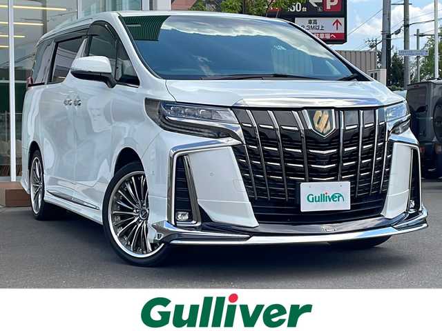 トヨタ アルファードハイブリット S タイプゴールド 道央・札幌 2020(令2)年 6.3万km ホワイトパールクリスタルシャイン ・４WD/・ワンオーナー/・衝突軽減ブレーキ/・サンルーフ/・モデリスタエアロ/・パーキングアシスト/・純正ナビ/　CD＆DVD＆BT＆TV/・バックカメラ/・全方位カメラ/・ブラインドスポットモニター/・パワーバックドア/・両側パワースライドドア/・フリップダウンモニター/・レーダークルーズコントロール/・コーナーセンサー/・レーンキープアシスト/・オートエアコン/・オートライト/・オートリトラミラー/・MT付きAT/・ビルトインETC/・JBLプレミアムサウンド/・三眼ライト/・プッシュスタート/・スマートキー/・クレンツェ20インチAW/・純正フロアマット/・ドアバイザー/・ウィンカーミラー/・フォグライト
