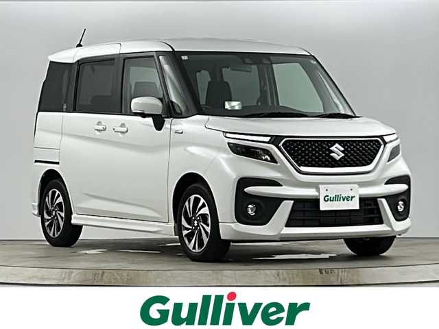 スズキ ソリオ バンディット HV MV 愛知県 2024(令6)年 1.3万km ピュアホワイトP 禁煙車/純正9インチナビ/（CD/DVD/Bluetooth/フルセグTV/USB）/全方位カメラ/スズキセーフティサポート/・衝突軽減ブレーキ/・レーンキープアシスト/・追従式クルーズコントロール/・オートマチックハイビーム/・クリアランスソナー/ヘッドアップディスプレイ/両側パワースライドドア/シートヒーター/スマートキー/プッシュスタート/スペアキー有/LEDヘッドライト