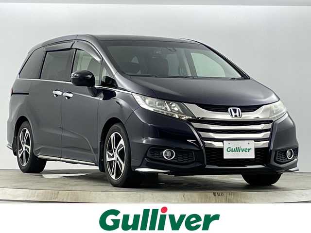 ホンダ オデッセイ アブソルート 愛知県 2014(平26)年 6.9万km プレミアムヴィーナスブラックP 禁煙車/９インチナビ/（AM/FM/Bluetooth/フルセグTV）/バックカメラ/フリップダウンモニター/クルーズコントロール/シティブレーキアクティブシステム/ドライブレコーダー/ETC/ハーフレザーシート/両側パワースライドドア/純正アルミホイール/LEDヘッドライト/オートライト/プッシュスタート/スマートキー/電動格納ミラー