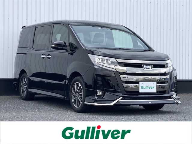 トヨタ ノア Si ダブルバイビーⅡ 千葉県 2020(令2)年 2.9万km ブラック 純正9インチナビ/(フルセグTV/BT/CD/DVD/FM/AM)/純正12インチフリップダウンモニター/モデリスタエアロ/バックカメラ/衝突被害軽減システム/車線逸脱警報/クルーズコントロール/ハーフレザーシート/両側パワースライドドア/横滑り防止装置/ビルトインETC/前後ドライブレコーダー/アイドリングストップ/LEDヘッドライト/フォグランプ/オートライト/ウィンカーミラー/電動格納ミラー/純正16インチAW/シートリフター/プッシュスタート/スマートキー/フロアマット/スペアキー/取扱説明書/保証書