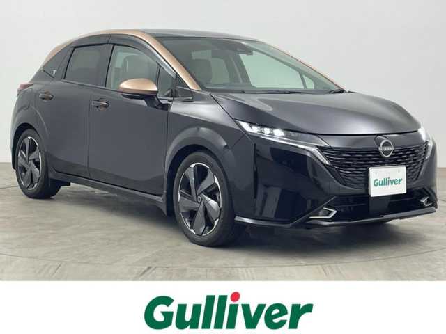 日産 オーラ G レザーエディション 大分県 2022(令4)年 1.2万km ミッドナイトブラック/サンライズカッパー 純正ナビ/（フルセグ/applecarplay/AM/FM)/BOSEサウンド/全周囲カメラ　/ＥＴＣ　/前後クリアランスソナー　/インテリジェントエマージェンシーブレーキ/・踏み間違い防止　/・車線逸脱防止支援システム　/・車線逸脱警報/・ふらつき警報　/・標識認識機能/・後側方衝突防止支援システム/・後側方車両検知警報/・後退車両検知警報/・オートマチックハイビーム/・ブラインドスポットモニター/デジタルインナーミラー/前方ドライブレコーダー/レザーシート/ステアリングヒーター/前席シートヒーター/電動パーキングブレーキ/オートブレーキホールド/オートライト/ステアリングスイッチ/LEDヘッドライト/フォグライト/プッシュスタート/純正アルミホイール/保証書・取扱説明書/スペアキー