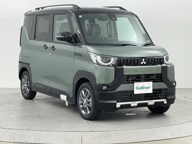 三菱 デリカミニ T プレミアム 新潟県 2025(令7)年 0.1千km 緑Ⅱ 4WD/MI-PILOT/純正ディスプレイオーディオ/　　BT/USB/AndroidAuto/AppleCarPlay/アラウンドビューモニター/両側パワースライドドア/レーダークルーズコントロール/LEDヘッドライト/ハーフレザーシート/シートヒーター/純正アルミホイール/ステアリングスイッチ/ステアリングヒーター/パドルシフト/スマートキー