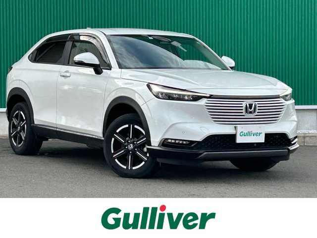 ホンダ ヴェゼル ハイブリッド e:HEV X 宮城県 2023(令5)年 3.7万km プラチナホワイトパール ワンオーナー/ホンダセンシング/・衝突軽減ブレーキ/・誤発進抑制機能/・後方誤発進抑制機能/・近距離衝突軽減ブレーキ/・歩行者事故低減ステアリング/・路外逸脱抑制機能/・渋滞追従機能付アダプティブクルーズコントロール/・車線維持支援システム/・先行車発進お知らせ機能/・標識認識機能/・オートハイビーム/・パーキングセンサーシステム/ブラインドスポットインフォメーション/社外9インチナビ/(フルセグTV/CD/DVD/SD/USB/BT)/車線逸脱踏み間違い衝突軽減システム/ドライブレコーダー/ETC/オートエアコン/ダウンヒルアシスト/パドルシフト/ステアリングスイッチ/ドライブセレクト/アイドリングストップ/オートライト/ふらつき防止/レベライザー/プッシュスタート＆スマートキー/ウインカー付き電動格納ミラー/ドアバイザー/スペアキー/LEDヘッドライト/フォグランプ/純正フロアマット/純正16インチAW