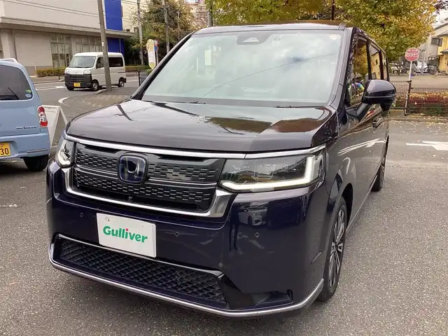 ホンダ ステップワゴン スパーダ eHEV プレミアムライン 神奈川県 2022(令4)年 1.1万km トワイライトミストブラックパール ワンオーナー/純正11.4型メモリーナビゲーション/Bluetooth　フルセグ　SD　CD　DVD　AppleCarPlay USB/フリップダウンモニタ/ドライブレコーダー/両側電動スライドドア/ホンダセンシング/マルチビューカメラ/ブラインドスポットインフォメーション/衝突軽減ブレーキ/歩行者事故低減ステアリング/渋滞追従機能付アダプティブクルーズコントロール/車線維持支援システム/先行車発進お知らせ機能/オートハイビーム/アダプティブドライビングビーム/誤発進抑制機能/近距離衝突軽減ブレーキ/路外逸脱抑制機能/トラフィックジャムアシスト/標識認識機能/ハーフレザーシート/前席二列目シートヒーター/ETC/パワーバックドア/電動サイドブレーキ/ブレーキオートホールド/2列目オットマン/革巻きステアリング/ステアリングスイッチ/パドルシフト/プッシュスタート/電動格納ミラー/純正フロアマット/ドアバイザー/オートライト/LEDヘッドライト/フォグライト/純正17インチアルミホイル