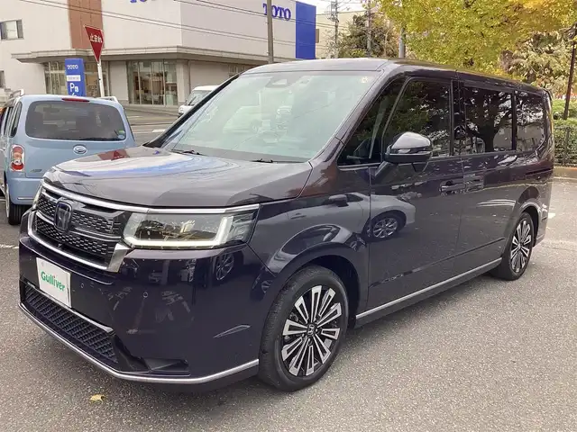 ホンダ ステップワゴン スパーダ eHEV プレミアムライン 神奈川県 2022(令4)年 1.1万km トワイライトミストブラックパール ワンオーナー/純正11.4型メモリーナビゲーション/Bluetooth　フルセグ　SD　CD　DVD　AppleCarPlay USB/フリップダウンモニタ/ドライブレコーダー/両側電動スライドドア/ホンダセンシング/マルチビューカメラ/ブラインドスポットインフォメーション/衝突軽減ブレーキ/歩行者事故低減ステアリング/渋滞追従機能付アダプティブクルーズコントロール/車線維持支援システム/先行車発進お知らせ機能/オートハイビーム/アダプティブドライビングビーム/誤発進抑制機能/近距離衝突軽減ブレーキ/路外逸脱抑制機能/トラフィックジャムアシスト/標識認識機能/ハーフレザーシート/前席二列目シートヒーター/ETC/パワーバックドア/電動サイドブレーキ/ブレーキオートホールド/2列目オットマン/革巻きステアリング/ステアリングスイッチ/パドルシフト/プッシュスタート/電動格納ミラー/純正フロアマット/ドアバイザー/オートライト/LEDヘッドライト/フォグライト/純正17インチアルミホイル