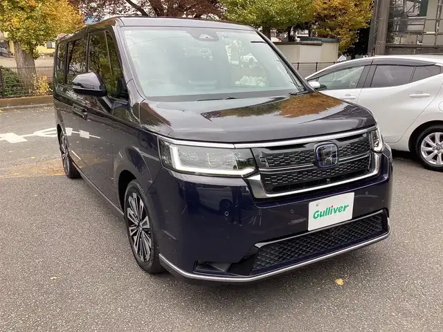 ホンダ ステップワゴン スパーダ eHEV プレミアムライン 神奈川県 2022(令4)年 1.1万km トワイライトミストブラックパール ワンオーナー/純正11.4型メモリーナビゲーション/Bluetooth　フルセグ　SD　CD　DVD　AppleCarPlay USB/フリップダウンモニタ/ドライブレコーダー/両側電動スライドドア/ホンダセンシング/マルチビューカメラ/ブラインドスポットインフォメーション/衝突軽減ブレーキ/歩行者事故低減ステアリング/渋滞追従機能付アダプティブクルーズコントロール/車線維持支援システム/先行車発進お知らせ機能/オートハイビーム/アダプティブドライビングビーム/誤発進抑制機能/近距離衝突軽減ブレーキ/路外逸脱抑制機能/トラフィックジャムアシスト/標識認識機能/ハーフレザーシート/前席二列目シートヒーター/ETC/パワーバックドア/電動サイドブレーキ/ブレーキオートホールド/2列目オットマン/革巻きステアリング/ステアリングスイッチ/パドルシフト/プッシュスタート/電動格納ミラー/純正フロアマット/ドアバイザー/オートライト/LEDヘッドライト/フォグライト/純正17インチアルミホイル