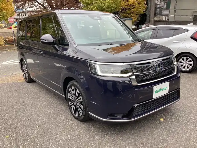 ホンダ ステップワゴン スパーダ eHEV プレミアムライン 神奈川県 2022(令4)年 1.1万km トワイライトミストブラックパール ワンオーナー/純正11.4型メモリーナビゲーション/Bluetooth　フルセグ　SD　CD　DVD　AppleCarPlay USB/フリップダウンモニタ/ドライブレコーダー/両側電動スライドドア/ホンダセンシング/マルチビューカメラ/ブラインドスポットインフォメーション/衝突軽減ブレーキ/歩行者事故低減ステアリング/渋滞追従機能付アダプティブクルーズコントロール/車線維持支援システム/先行車発進お知らせ機能/オートハイビーム/アダプティブドライビングビーム/誤発進抑制機能/近距離衝突軽減ブレーキ/路外逸脱抑制機能/トラフィックジャムアシスト/標識認識機能/ハーフレザーシート/前席二列目シートヒーター/ETC/パワーバックドア/電動サイドブレーキ/ブレーキオートホールド/2列目オットマン/革巻きステアリング/ステアリングスイッチ/パドルシフト/プッシュスタート/電動格納ミラー/純正フロアマット/ドアバイザー/オートライト/LEDヘッドライト/フォグライト/純正17インチアルミホイル