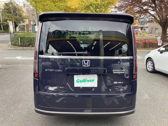 ホンダ ステップワゴン スパーダ eHEV プレミアムライン 神奈川県 2022(令4)年 1.1万km トワイライトミストブラックパール ワンオーナー/純正11.4型メモリーナビゲーション/Bluetooth　フルセグ　SD　CD　DVD　AppleCarPlay USB/フリップダウンモニタ/ドライブレコーダー/両側電動スライドドア/ホンダセンシング/マルチビューカメラ/ブラインドスポットインフォメーション/衝突軽減ブレーキ/歩行者事故低減ステアリング/渋滞追従機能付アダプティブクルーズコントロール/車線維持支援システム/先行車発進お知らせ機能/オートハイビーム/アダプティブドライビングビーム/誤発進抑制機能/近距離衝突軽減ブレーキ/路外逸脱抑制機能/トラフィックジャムアシスト/標識認識機能/ハーフレザーシート/前席二列目シートヒーター/ETC/パワーバックドア/電動サイドブレーキ/ブレーキオートホールド/2列目オットマン/革巻きステアリング/ステアリングスイッチ/パドルシフト/プッシュスタート/電動格納ミラー/純正フロアマット/ドアバイザー/オートライト/LEDヘッドライト/フォグライト/純正17インチアルミホイル
