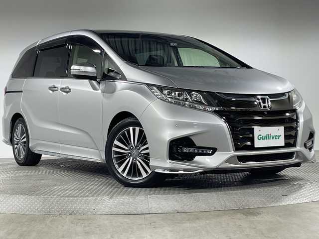 ホンダ オデッセイ アブソルート・EXホンダセンジング 神奈川県 2019(平31)年 6.1万km スーパープラチナメタリック ホンダセンシング/純正9型ナビ【VXM-197VFNi】/・BT/フルセグTV/SD/CD/DVD/HDNI/USB/全方位カメラ/両側電動スライドドア/ECON/コーナーセンサー/アイドリングストップ機能/スマートキー/プッシュスタートボタン/ビルトインETC2.0/前後ドライブレコーダー/ハーフレザーシート/パワーシート(D/N)/シートヒーター(D/N)/革巻きステアリング/ステアリングスイッチ/Autoライト/パドルシフト/オットマン/LEDヘッドライト/フォグランプ/電動格納ミラー/ウィンカーミラー/純正フロアマット/純正17インチアルミホイール/純正ドアバイザー