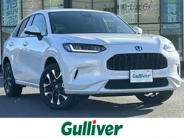 ホンダ ＺＲ－Ｖ ハイブリッド e:HEV Z 岡山県 2024(令6)年 4万km プラチナホワイトパール 登録時走行距離39348km/純正9インチナビ/フルセグTV(AM.FM.TV.BT)/全方位カメラ/ETC2.0/ブラインドスポットモニター/シートヒーター/ステアリングヒーター/クリアランスソナー/衝突軽減ブレーキ/横滑り防止装置/クルーズコントロール(追従走行あり)/車線逸脱警報（レーンキープアシスト）/オートライト/オートマチックハイビーム/アイドリングストップ/電動リアゲート/18インチ純正AW/純正フロアマット/レザーシート/D+N席パワシート/保証書/取扱説明書