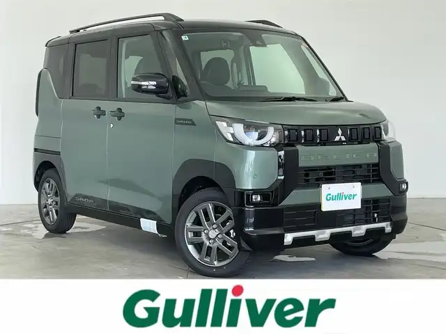 三菱 デリカミニ T プレミアム 富山県 2025(令7)年 0.1千km 緑Ⅱ 登録済未使用車/4WD/純正9型DA（AM/FM/CD/DVD/USB/BT）/バックカメラ/デジタルインナーミラー/両側パワースライドドア/衝突被害軽減ブレーキ/アダプティブクルーズコントロール/レーンキープアシスト/オートマチックハイビーム/LEDヘッドライト/クリアランスソナー/ハーフレザーシート/前席シートヒーター/純正15インチAW/スマートキー×２/プッシュスタート/純正フロアマット/取扱説明書/保証書
