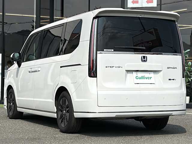ホンダ ステップワゴン スパーダ eHEV 大阪府 2022(令4)年 6.1万km プラチナホワイトパール 衝突軽減　純正１１.4インチナビ フリップダウンモニター　両側パワースライドドア　ＢＳＭ　レーダークルーズコントロール　マルチビュー　プラズマクラスター　デュアルエアコン　運転支援　コーナーセンサー　電動リアゲート　前列シートヒーター　フルセグテレビ　オットマン　プッシュスタート　パワーバックドア　ETC　LEDヘッドライト　スマートキー　ハーフレザーシート
