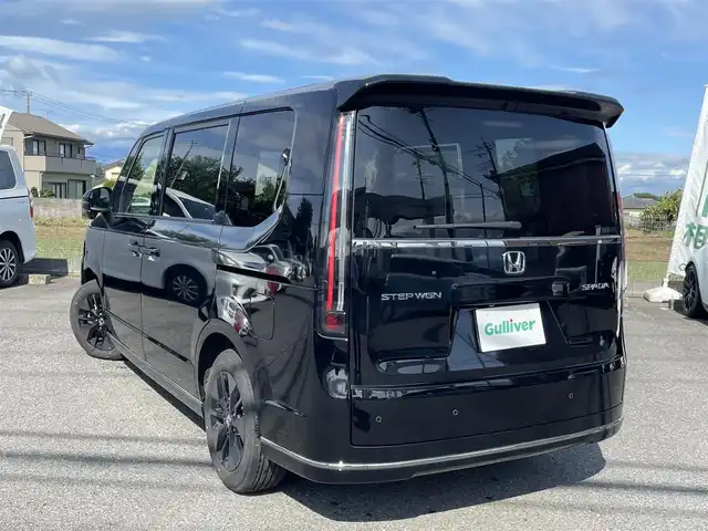 ホンダ ステップワゴン スパーダ 千葉県 2024(令6)年 0.5万km クリスタルブラックパール ワンオーナー/11.4インチ純正メモリナビ、地デジ、Bluetooth、CD、DVD/　（LXM-247VFNi）/バックカメラ/ホンダセンシング/パドルシフト/ウインカーミラー/革巻きステア/ハーフレザーシート/前席シートヒーター/両側パワースライドドア/パワーバックドア/レーダークルーズコントロール/W・サイド・カーテンエアバッグ/ETC/LEDヘッドライト/コーナーセンサー（前後）/２列目オットマン/ブラインドスポットインフォメーション/保証書、取説