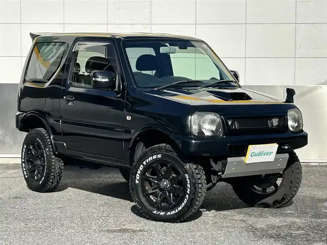 スズキ ジムニー クロスアドベンチャー XC 東京都 2012(平24)年 12.5万km ブルーイッシュブラックパール3 2インチアップ/社外ディスプレイオーディオ/　Bluetooth/AM・FM/AppleCarPlay/AndroidAuto/社外マフラー/社外リアスポイラー/シートヒーター/純正ハーフレザーシート/純正フロアマット/パワーウィンドウ/パワーステアリング/電動格納ミラー/ウインカーミラー/ドアバイザー/リモコンキー/保証書
