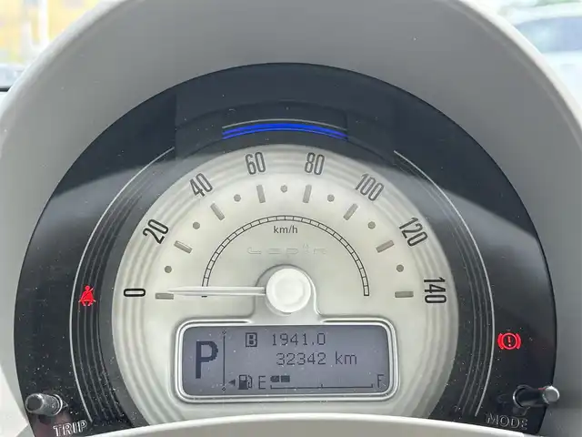 スズキ ラパン L 愛媛県 2016(平28)年 7.4万km シフォンアイボリーM 禁煙車/登録時走行距離：73674km/ディーラーオプション純正ナビ/CD/DVD/iPod/ワンセグTV/CDチェンジャー/前後ドライブレコーダー/衝突被害軽減システム/横滑り防止装置/盗難防止装置/エンジンスタートボタン/アイドリングストップ/シートヒーター/フルフラットシート
