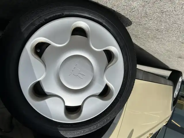 スズキ ラパン L 愛媛県 2016(平28)年 7.4万km シフォンアイボリーM 禁煙車/登録時走行距離：73674km/ディーラーオプション純正ナビ/CD/DVD/iPod/ワンセグTV/CDチェンジャー/前後ドライブレコーダー/衝突被害軽減システム/横滑り防止装置/盗難防止装置/エンジンスタートボタン/アイドリングストップ/シートヒーター/フルフラットシート