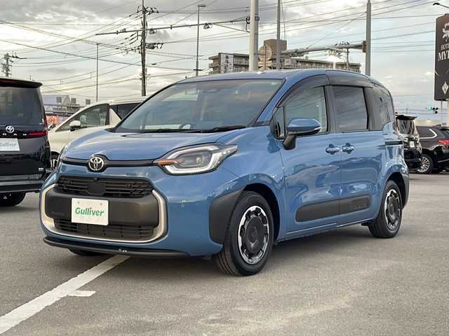 トヨタ シエンタ ハイブリッド Z 徳島県 2023(令5)年 0.8万km グレイッシュブルー 純正10型ナビゲーション/・フルセグTV/CD/DVD/HDMI/Bluetooth/パノラミックビューモニター/フリップダウンモニター/両側パワースライドドア/ブラインドスポットモニター/ドライブレコーダー/シートヒーター/ステアリングヒーター/ミラーヒーター/100V電源/USBポート/ビルトインETC/純正LEDヘッドライト/純正フロアマット/スペアキー1本/トヨタセーフティーセンス/・プリクラッシュセーフティ/・レーンディパーチャーアラート /・レーントレーシングアシスト/・ロードサインアシスト/・先行車発進告知機能/・レーダークルーズコントロール/・アダプティブハイビームシステム
