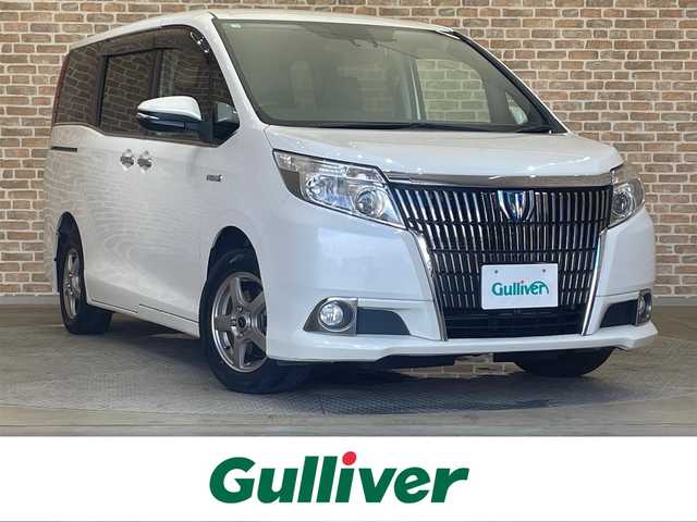 トヨタ エスクァイア ハイブリッド Gi 岩手県 2016(平28)年 9.1万km ホワイトパールクリスタルシャイン 両側パワースライドドア/寒冷地仕様/トヨタセーフティセンスC/プリクラッシュセーフティ/レーンディパーチャーアラート/オートマチックハイビーム/先行車発進告知機能/クルーズコントロール/リアオートエアコン/KENWOODナビ/フルセグ TV/バッグカメラ、フロントカメラ/ステアリングスイッチ/ETC/横滑り防止装置/アイドリングストップ/ロールサンシェード/ワイパーデアイサー/LEDヘッドランプ/社外15インチアルミホイール