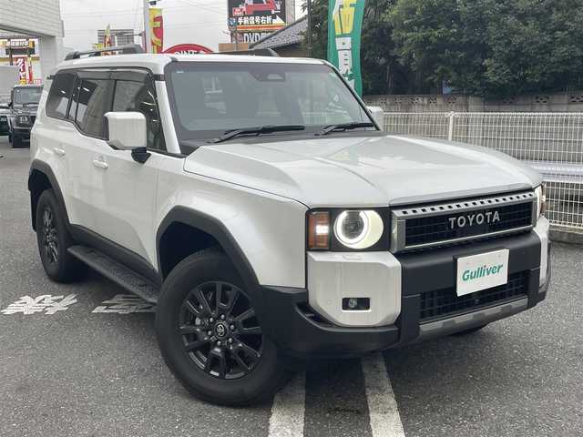 トヨタ ランドクルーザー ２５０ VX 道東・釧路十勝 2024(令6)年 0.4万km プラチナホワイトパールマイカ ワンオーナー/トヨタセーフティセンス/・プリクラッシュセーフティ/・レーンディパーチャーアラート/・ブラインドスポットモニター/・クリアランスソナー/・ロードサインアシスト/・レーダークルーズコントロール/純正T-Connectトナビ/　DTV/Bluetooth/　AppleCarPlay/AndroidAuto/　USB/HDMI/Miracast/サンルーフ/パノラミックビューモニター/デジタルインナーミラー/ビルトインETC2.0/パワーバックドア/革巻きステアリング/ステアリングスイッチ/ステアリングヒーター/前席シートヒーター/前席シートベンチレーション/運転席パワーシート/電子パーキング/ブレーキオートホールド/プッシュスタート/スマートキー/丸目LEDヘッドライト/フォグランプ/オートライト/オートマチックハイビーム