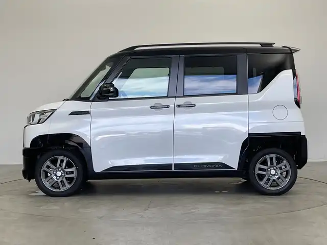 三菱 デリカミニ T プレミアム 新潟県 2025(令7)年 0.1千km アメジストブラック/シルキーホワイト 4WD/プロパイロット/純正ディスプレイオーディオ/　AppleCarPlay/AndroidAuto/Bluetooth/HDMI/全方位モニター/両側パワースライドドア/衝突被害軽減ブレーキ/レーンキープアシスト/前後コーナーセンサー/レーダークルーズコントロール/ハーフレザーシート/前席シートヒーター/オートマチックハイビーム/LEDヘッドライト/オートライト/ステアリングヒーター/パドルシフト/禁煙車